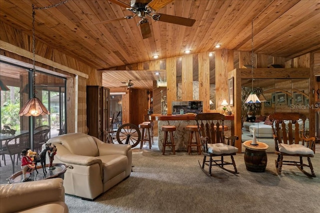 935 Ranch Rd, Tarpon Springs, FL 34688 - living area with wooden walls, carpet floors, wooden ceiling, and a ceiling fan