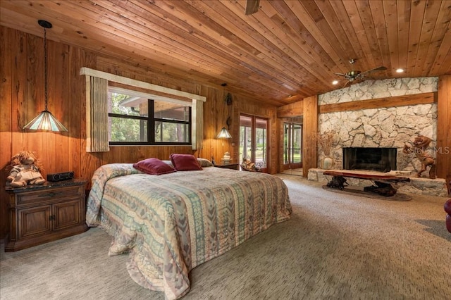 935 Ranch Rd, Tarpon Springs, FL 34688 - bedroom featuring multiple windows, carpet flooring, wood ceiling, wooden walls, and vaulted ceiling