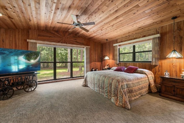 935 Ranch Rd, Tarpon Springs, FL 34688 - carpeted bedroom with wooden ceiling, wooden walls, lofted ceiling, multiple windows, and a ceiling fan