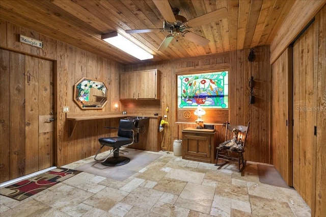 935 Ranch Rd, Tarpon Springs, FL 34688 - bar area featuring wooden ceiling, stone tile flooring, wood walls, and a ceiling fan