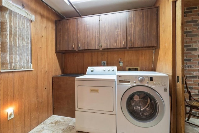 935 Ranch Rd, Tarpon Springs, FL 34688 - washroom with washer and clothes dryer, cabinet space, and wood walls