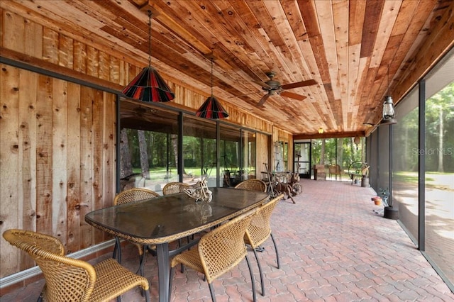 935 Ranch Rd, Tarpon Springs, FL 34688 - sunroom / solarium with ceiling fan, outdoor dining space, and plenty of natural light