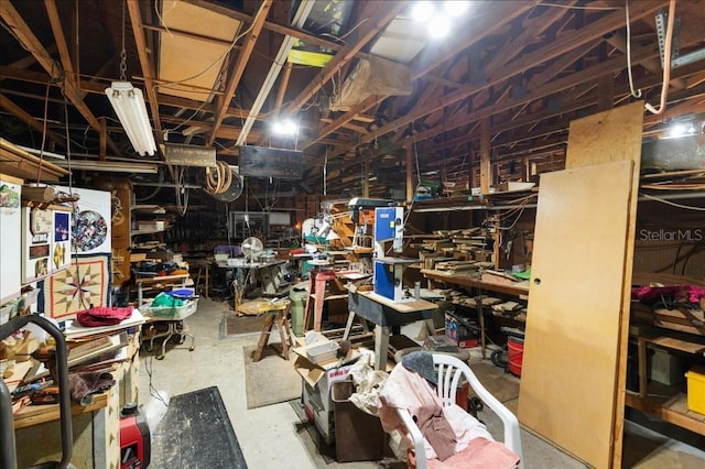 935 Ranch Rd, Tarpon Springs, FL 34688 - unfinished basement featuring a workshop area