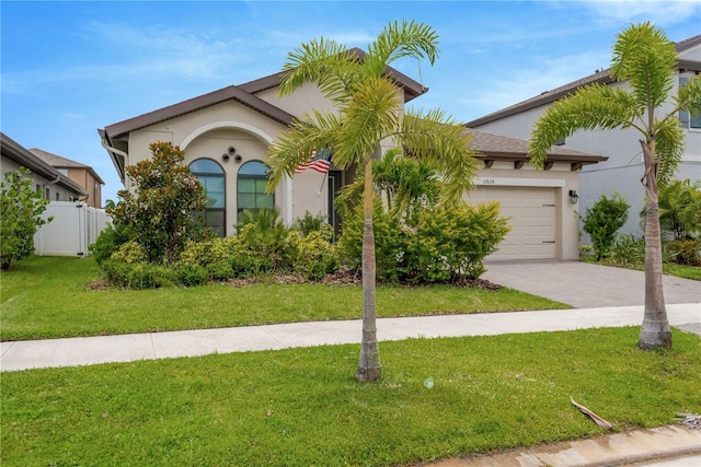 12828 Satin Lily Dr, Riverview, FL 33579 - view of front of property with a garage, stucco siding, and driveway