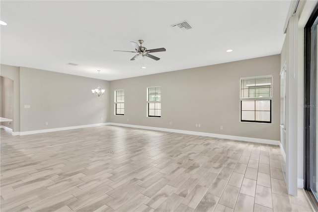 12828 Satin Lily Dr, Riverview, FL 33579 - spare room with plenty of natural light, a ceiling fan, recessed lighting, a chandelier, and light wood-style flooring