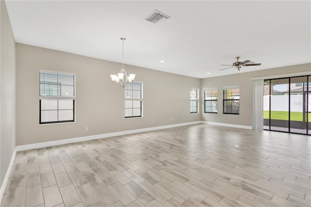 12828 Satin Lily Dr, Riverview, FL 33579 - empty room with a chandelier, recessed lighting, a ceiling fan, and wood finish floors
