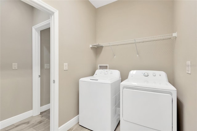 12828 Satin Lily Dr, Riverview, FL 33579 - laundry area featuring independent washer and dryer and light wood-type flooring