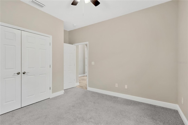12828 Satin Lily Dr, Riverview, FL 33579 - unfurnished bedroom featuring light colored carpet, a closet, and a ceiling fan