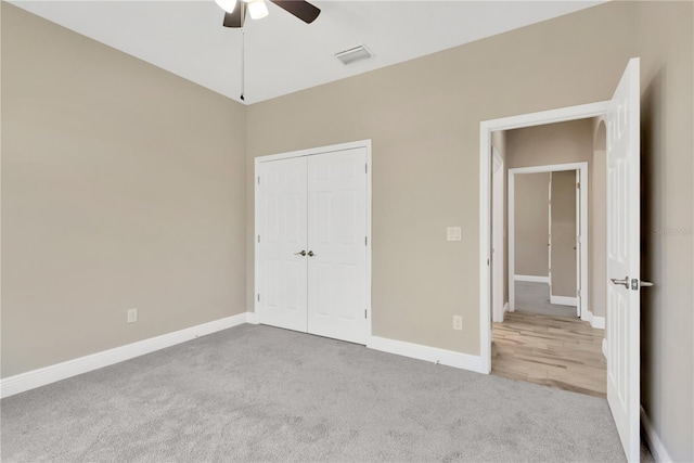 12828 Satin Lily Dr, Riverview, FL 33579 - unfurnished bedroom featuring carpet floors, a closet, and a ceiling fan