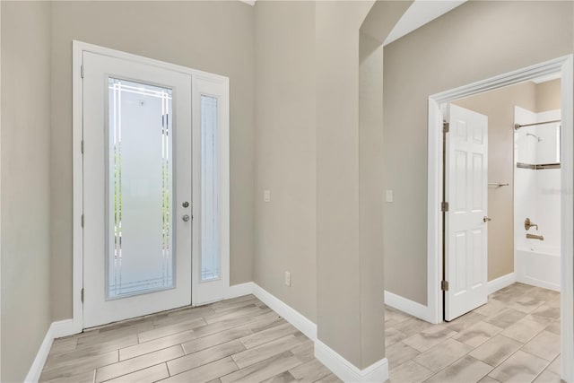 12828 Satin Lily Dr, Riverview, FL 33579 - foyer featuring baseboards and light wood finished floors
