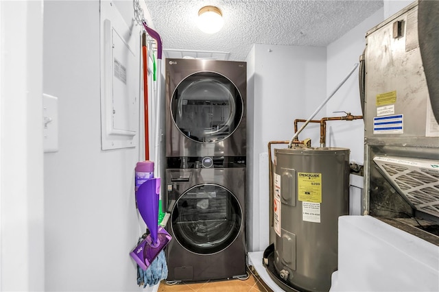 1918 Pelican Landing Blvd Unit 1112, Clearwater, FL 33762 - utility room featuring stacked washer / dryer and water heater