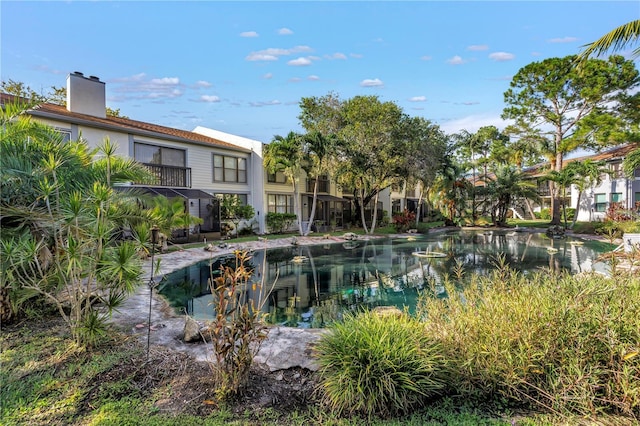 1918 Pelican Landing Blvd Unit 1112, Clearwater, FL 33762 - view of pool featuring a small pond