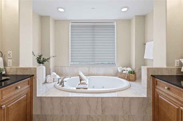 400 Beach Dr NE Unit 2301, Saint Petersburg, FL 33701 - bathroom featuring vanity and a tub with jets