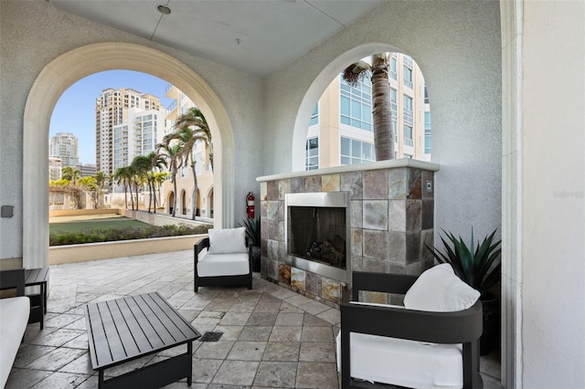 400 Beach Dr NE Unit 2301, Saint Petersburg, FL 33701 - view of patio / terrace featuring a tile fireplace and a city view
