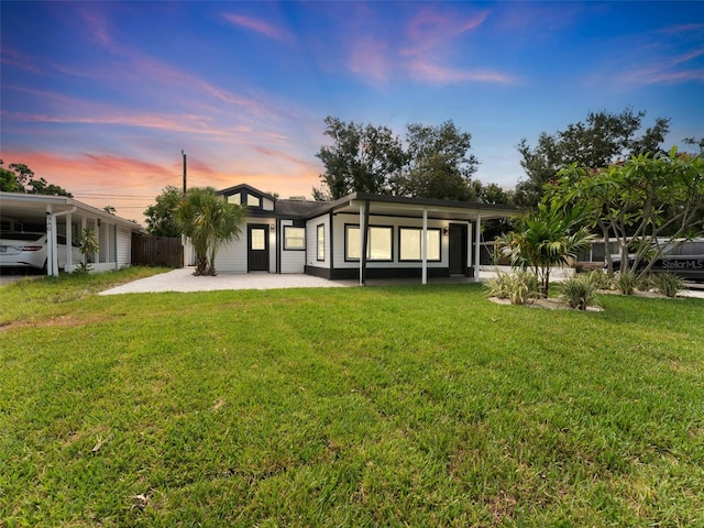 960 65th St S, Saint Petersburg, FL 33707 - back of property at dusk with a patio