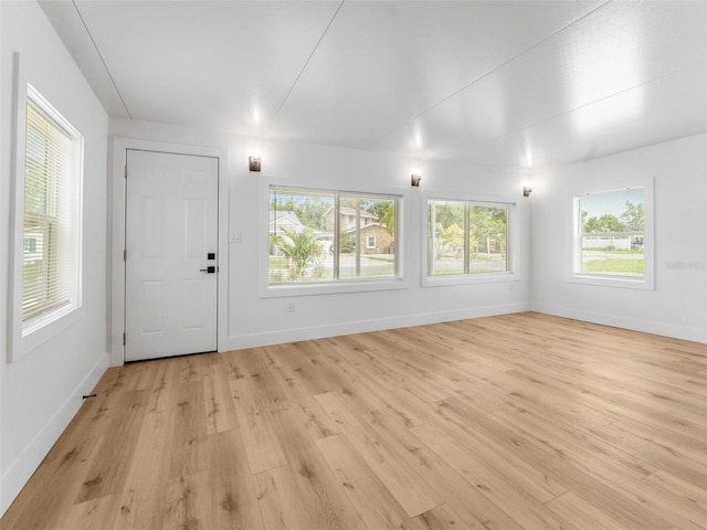 960 65th St S, Saint Petersburg, FL 33707 - foyer entrance featuring light wood-style floors and plenty of natural light