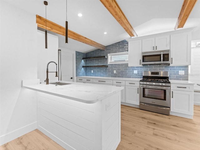 960 65th St S, Saint Petersburg, FL 33707 - kitchen with appliances with stainless steel finishes, light wood-type flooring, decorative backsplash, and recessed lighting