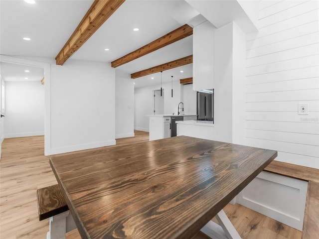 960 65th St S, Saint Petersburg, FL 33707 - dining room with recessed lighting, light wood-style floors, and beamed ceiling