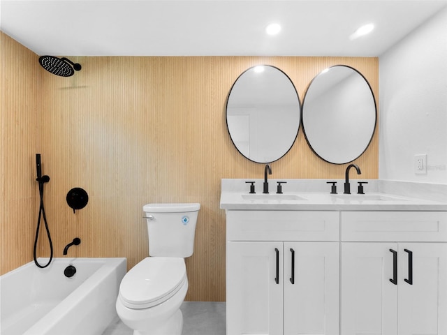960 65th St S, Saint Petersburg, FL 33707 - full bath featuring double vanity, bathtub / shower combination, and recessed lighting