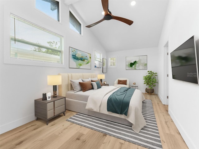 960 65th St S, Saint Petersburg, FL 33707 - bedroom with light wood-style floors, high vaulted ceiling, and ceiling fan