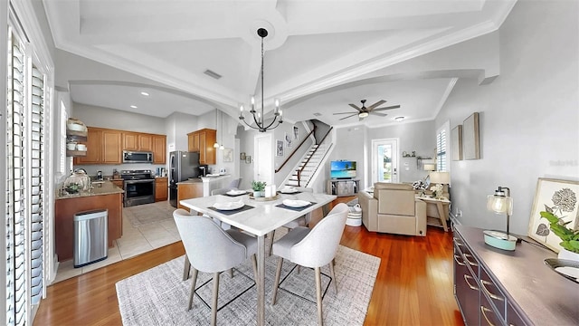 6545 Simone Shores Cir, Apollo Beach, FL 33572 - dining space with stairway, ceiling fan, light wood-style floors, crown molding, and recessed lighting