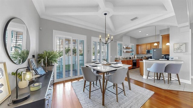 6545 Simone Shores Cir, Apollo Beach, FL 33572 - dining area with a chandelier, plenty of natural light, light wood-style flooring, recessed lighting, and beamed ceiling