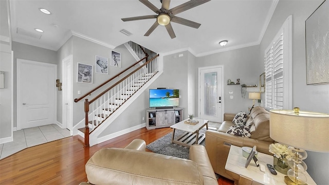 6545 Simone Shores Cir, Apollo Beach, FL 33572 - living area with stairway, wood finished floors, a ceiling fan, ornamental molding, and recessed lighting