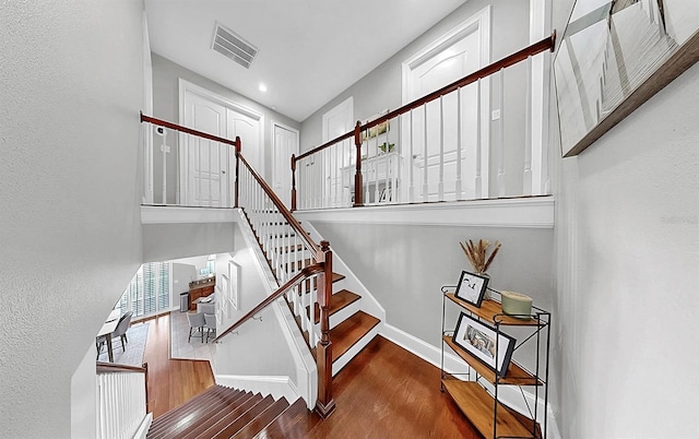 6545 Simone Shores Cir, Apollo Beach, FL 33572 - stairs with wood finished floors and a high ceiling