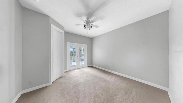 6545 Simone Shores Cir, Apollo Beach, FL 33572 - carpeted spare room with french doors and ceiling fan