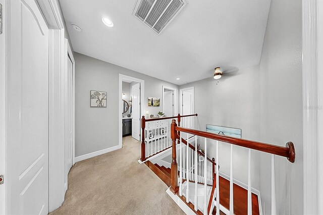 6545 Simone Shores Cir, Apollo Beach, FL 33572 - hallway featuring an upstairs landing, light carpet, and recessed lighting
