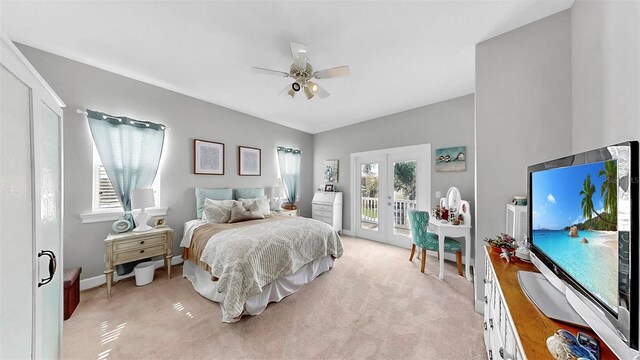 6545 Simone Shores Cir, Apollo Beach, FL 33572 - bedroom featuring access to outside, french doors, light colored carpet, and a ceiling fan