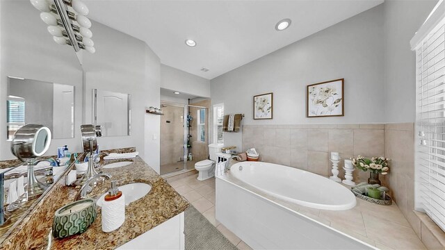 6545 Simone Shores Cir, Apollo Beach, FL 33572 - full bathroom with a shower stall, a garden tub, double vanity, tile patterned flooring, and recessed lighting