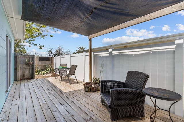 7950 Causeway Blvd N, Saint Petersburg, FL 33707 - wooden terrace with outdoor dining space