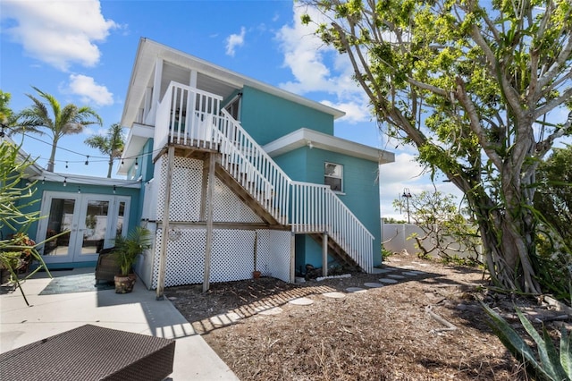 7950 Causeway Blvd N, Saint Petersburg, FL 33707 - back of property featuring stairway and french doors