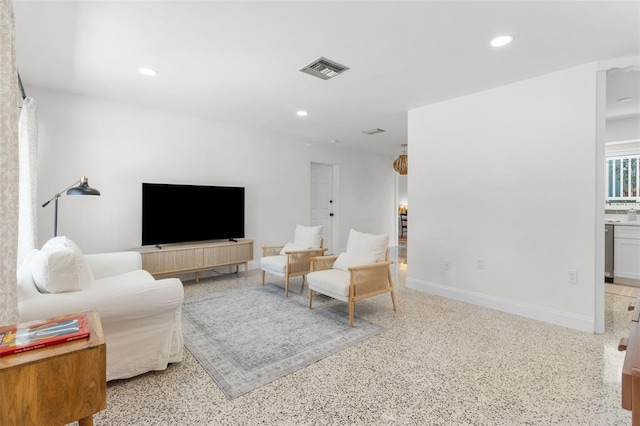 7950 Causeway Blvd N, Saint Petersburg, FL 33707 - living area featuring dark aggregate flooring and recessed lighting