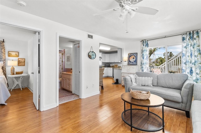 7950 Causeway Blvd N, Saint Petersburg, FL 33707 - living area featuring ceiling fan and light wood finished floors