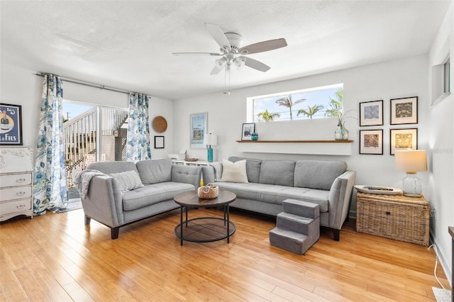 7950 Causeway Blvd N, Saint Petersburg, FL 33707 - living room with light wood finished floors and a ceiling fan