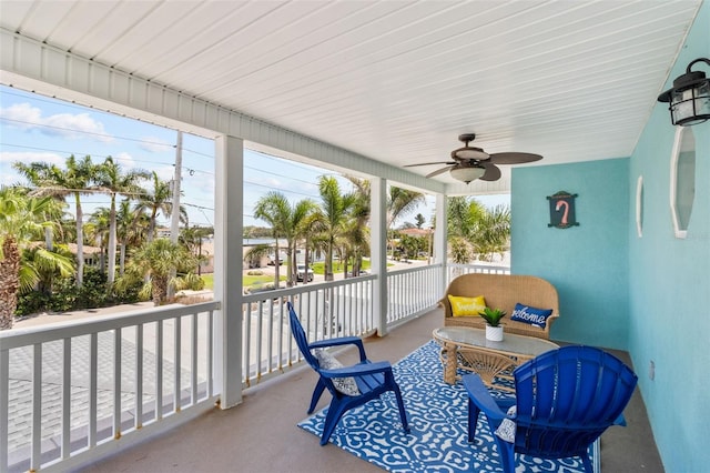 7950 Causeway Blvd N, Saint Petersburg, FL 33707 - sunroom / solarium featuring a ceiling fan and an outdoor hangout area
