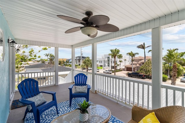 7950 Causeway Blvd N, Saint Petersburg, FL 33707 - sunroom featuring a residential view and a ceiling fan