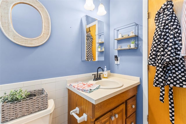 7950 Causeway Blvd N, Saint Petersburg, FL 33707 - half bathroom with vanity and wainscoting