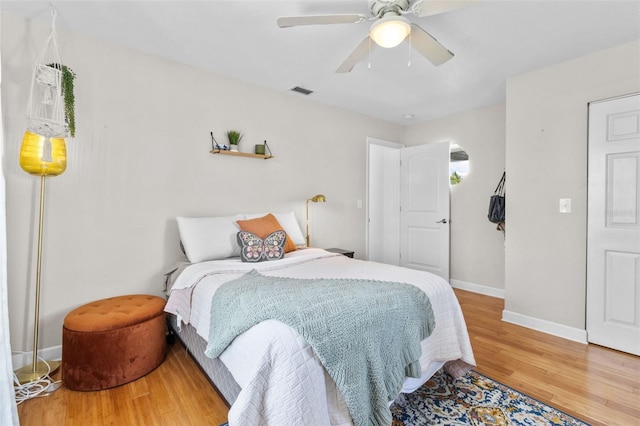 7950 Causeway Blvd N, Saint Petersburg, FL 33707 - bedroom with wood finished floors and a ceiling fan