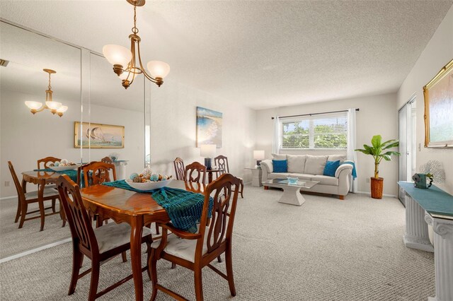 1701 Pinehurst Rd Unit 18D, Dunedin, FL 34698 - dining area with light carpet, a chandelier, and a textured ceiling