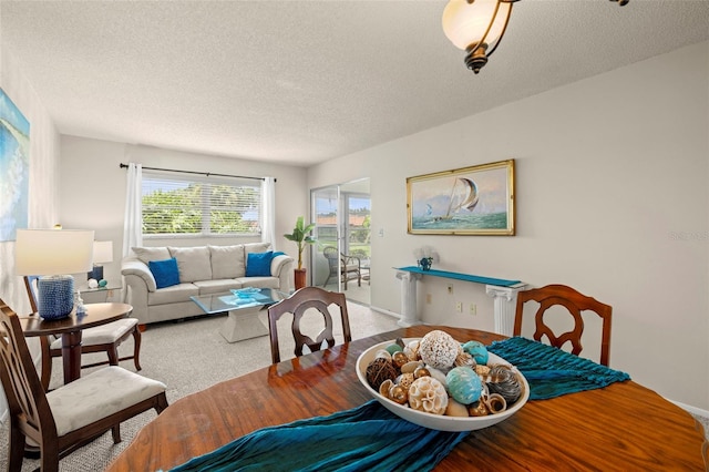 1701 Pinehurst Rd Unit 18D, Dunedin, FL 34698 - carpeted dining area with a textured ceiling