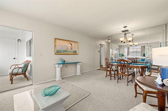 1701 Pinehurst Rd Unit 18D, Dunedin, FL 34698 - living area featuring carpet, a chandelier, and a textured ceiling