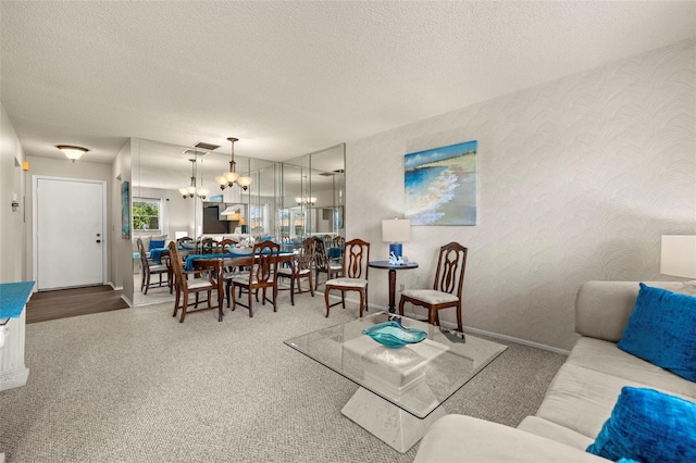 1701 Pinehurst Rd Unit 18D, Dunedin, FL 34698 - living area with a chandelier, carpet floors, and a textured ceiling