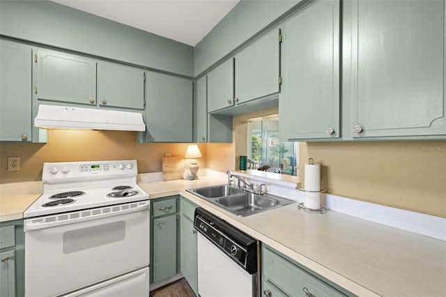1701 Pinehurst Rd Unit 18D, Dunedin, FL 34698 - kitchen with white appliances, ventilation hood, light countertops, and green cabinetry