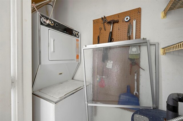 1701 Pinehurst Rd Unit 18D, Dunedin, FL 34698 - laundry area featuring stacked washer / drying machine