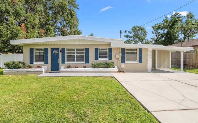 2614 W Idlewild Ave, Tampa, FL 33614 - single story home with concrete driveway, an attached carport, and covered porch