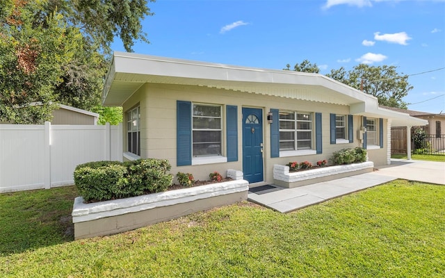 2614 W Idlewild Ave, Tampa, FL 33614 - view of front of house featuring concrete driveway and an attached carport