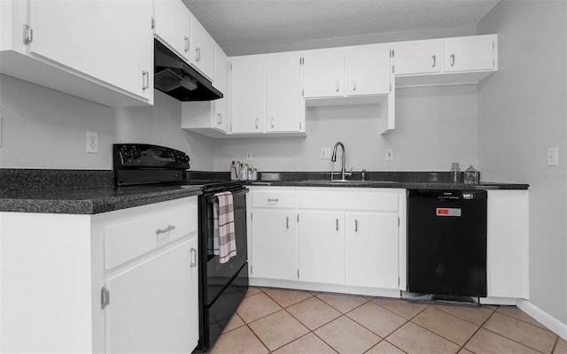 2614 W Idlewild Ave, Tampa, FL 33614 - kitchen featuring black appliances, under cabinet range hood, dark countertops, white cabinetry, and light tile patterned floors
